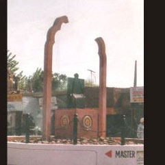 Monument in NSS - Phatti-Basta on the heap of rubble with a broken overrhead arc<br>Concrete and Fibre Glass - 10'<br>1995